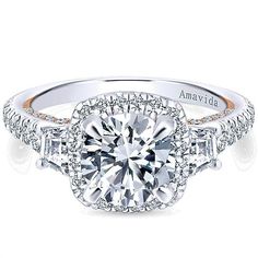 a white gold engagement ring with round diamonds