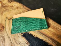 "The Farasta Wallet. This is a hand stitched, hand finished veg tan leather cardholder suitable for 6-8 cards and some folded cash. Main card pocket: Natural Buttero from Conceria Walpier. Outer pockets: Menta Country by Conceria La Perla Azzurra. Thread: Crimson Hides.  Appox size: 4.25\" x 2.75\"" Artisan Card Holder With Interior Slots, Artisan Bifold Card Holder With Interior Slots, Leather Cardholder, Clip Wallet, Veg Tan Leather, Money Clip Wallet, Card Holder Leather, Hand Stitched, Tan Leather