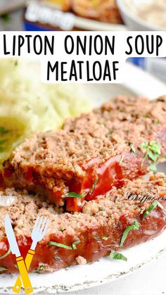 a close up of meatloaf on a plate with utensils next to it