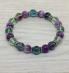 ~ Bracelets by Karen ~ Fluorite and Amethyst with Silver Spacers -12 Crystal Beads Bracelets Ideas, Memory Bracelets Ideas, Gemstone Stretch Bracelets, Beaded Stretch Bracelets Ideas, Shiny Bracelets, Fluorite Bracelet, Diamond Bracelet Design, Beautiful Beaded Bracelet, Classic Bracelets