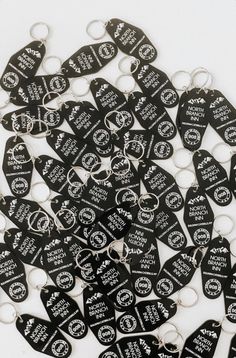 black guitar picks with white lettering are arranged in a circle on top of each other