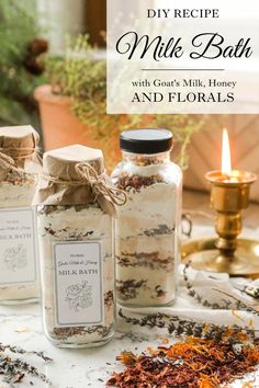 three jars filled with different types of spices and herbs on top of a white table