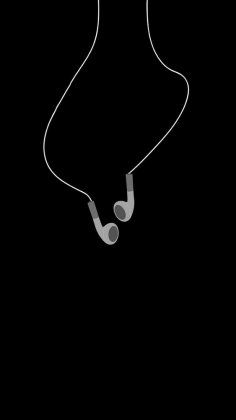 the silhouette of a woman with headphones in her ears, against a black background