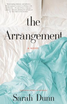 the arrangement by sarah dum is shown in front of an unmade bed