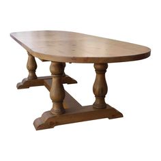 a wooden table with two legs and a large oval shaped dining table on one end