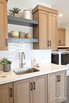 a kitchen with wooden cabinets and white counter tops, an open shelving above the sink