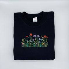 Wildflowers Custom Embroidered Crewneck Sweatshirt Perfect crewneck to start a conversation or to make a funny statement. This is guaranteed to be a good gift for anybody in your life. All material and options are embroidered on high quality HANES products (see below).  This item is made to order so allow 1-2 weeks processing time plus the additional time for shipping. All items and orders over $35 ship free to the U.S.  Ensure you choose the correct color, item style, and item size when checking out. If you have any questions send me a message so I can ensure you receive the right product. Hanes Products: -Crewneck: 9.7 oz, 90% cotton, 10% polyester (style F260) -hoodless, low pill, double-needle coverseamed neck, armholes, and waistband Floral Clothing, To Start A Conversation, Funny Statements, Embroidery Floral, Embroidered Crewneck, Floral Outfit, Cute Sweatshirts, Flower Shirt, Floral Embroidery