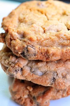 three chocolate chip cookies stacked on top of each other