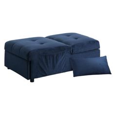 a blue ottoman with two pillows on it