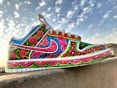 Pakistan truck art shoes  Introducing our exquisite handmade truck art shoes for women, a stunning fusion of Pakistani tradition and contemporary fashion. These one-of-a-kind shoes are meticulously crafted with utmost care and attention to detail, bringing the vibrant spirit of Pakistan's truck art to your feet. Each pair of shoes is a true work of art, featuring intricate hand-painted designs inspired by the lively and colorful motifs found on Pakistani trucks. From swirling patterns and intricate florals to eye-catching geometric shapes, every brushstroke tells a story and captures the essence of Pakistani culture. These handmade truck art shoes make a perfect gift for the style-conscious woman who appreciates artistry and seeks to embrace diverse cultures. Each pair is a symbol of creat Artsy Hand Painted Multicolor Sneakers, Hand Painted Multicolor Sneakers For Summer, Artistic Multicolor Sneakers For Summer, Artistic Hand Painted Custom Sneakers For Spring, Artistic Hand Painted Multicolor Custom Sneakers, Artistic Multicolor Summer Sneakers, Artistic Hand-painted Multicolor Custom Sneakers, Artistic Multicolor Spring Sneakers, Truck Art Motifs