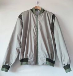 "1970s 80s Vintage Mod Casual Bomber Jacket.  Label: Size M Made in England  Please see measurements below to determine desired fit. (Layed flat) 25.5\" pit to pit 23.5\" shoulder to shoulder  20.5\" underarm 26\" long (back length) Features: Ribbed colour Collar and Cuffs. Striped Lining Full front zipper fastening  Polyester Cotton mix. Offered in very good vintage condition." Striped Winter Streetwear Outerwear, Winter Striped Streetwear Outerwear, Striped Outerwear For Winter Streetwear, Vintage Striped Winter Outerwear, Retro Spring Outerwear With Ribbed Cuffs, Striped Outerwear With Ribbed Cuffs For Winter, Vintage Striped Outerwear For Spring, Vintage Striped Spring Outerwear, Spring Retro Lined Outerwear