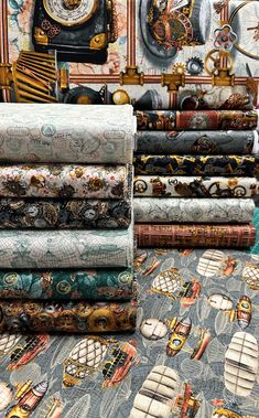 there are many different types of fabric on the tablecloths in this room, including clocks and boats