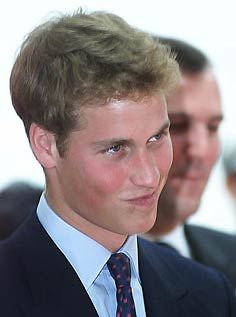 a young man wearing a suit and tie