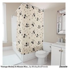 a bathroom with a mickey mouse shower curtain