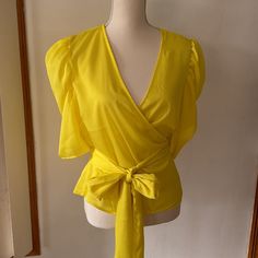 New York & Company V-Neck Wrap Tie Waist Top Ballon Sleeve V-Neck Waist Tie Nwt 100% Polyester *Color Of The Garment May Vary Due To Lighting * We Also Reuse All Boxes/Bags/Packaging For Shipping. Sold As Is. Smoke Free Home. Fast Shipping. Bundle & Save! Fitted V-neck Top For Summer Party, Fitted V-neck Top For Spring Party, Fitted V-neck Top For Spring Day Out, Summer V-neck Blouse For Night Out, Elegant Yellow V-neck Top, Chic Solid Color V-neck Top For Summer, Spring V-neck Tops For Night Out, Summer V-neck Top For Night Out, V-neck Tops For Summer Night Out