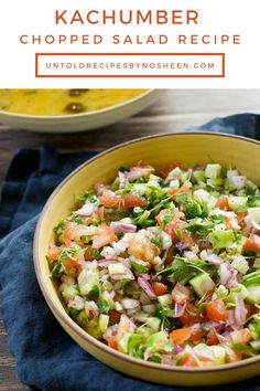 a yellow bowl filled with chopped salad on top of a blue towel