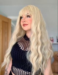 🌟 Welcome to VixenWig! 🌟 Introducing Ivy, one of our top bestsellers! This 26-Inch Wavy Blonde Wig with bangs is the perfect blend of natural beauty and everyday elegance. Whether you're dressing up for a party, vacation, or just want to elevate your daily look, Ivy's luxurious golden waves will have you turning heads everywhere. 👑✨ 🔮 Material: 100% Heat-Resistant Premium Synthetic Fiber 🔮 Parting Style: Skin Top for a realistic, natural look 🔮 Color: Stunning Blonde 🔮 Head Size: Adjustab Gold Wig, Gold Wigs, Wig Blonde, Everyday Elegance, Glam Looks, Blonde Wig, Light Blonde, Long Wigs, Wigs With Bangs