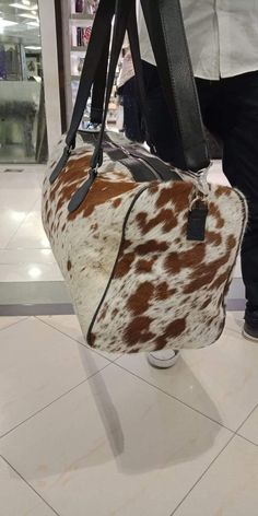 All our cowhide bags are free shipping all worldwide. These cowhide weekender bags are one of its kind, custom made to order, we will select a gorgeous cowhide rug and only premium leather will be used. Our cowhide duffle bag is a perfect addtion for your next getaway. It carries all your essentials for your next beach Bag For Airport, Western Bags, Modern Backpack, Western Bag, Cowhide Handbags, Weekender Bags, Cowhide Bag, Cowhide Rugs, Rattan Bag