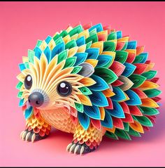 an animal made out of colored paper on a pink background