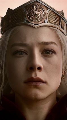 a close up of a person wearing a crown