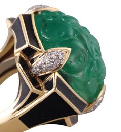 Impressive David Webb ring in 18k gold and platinum, set with center 21mm x 21mm carved emerald, and approx. 0.28ctw Si/H diamonds. Retail $62000. DESIGNER: David Webb MATERIAL: 18k Gold / Platinum GEMSTONES: Diamond, Emerald DIMENSIONS: Ring size 5.75, each end is 9mm in diameter. MARKED/TESTED: ES 213, David Webb 18k, 900Pt. WEIGHT: 28.5 grams CONDITION: Previously Owned/Excellent Condition David Webb Ring, Carved Emerald, David Webb, Diamond Gold, Platinum Ring, Emerald Diamond, Gold Platinum, Gold Diamond, Gold Rings