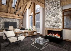 a living room filled with furniture and a fire place next to a stone wall covered in windows