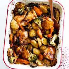 a casserole dish filled with chicken and vegetables