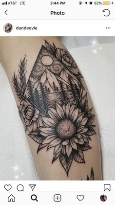 a black and white photo of a sunflower tattoo on the left thigh, with an arrow in the middle