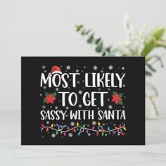 a christmas card with the words most likely to get sassy with santa on it