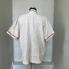 MADE IN MEXICO SELLING ONLY BY COLOR. We've received a large quantity of guayaberas imported from Mexico. The embroidery pattern might be different from the picture. But you will receive a genuinely unique, beautiful, detailed guayabera. For: Men Color: off-white Details: 100% Linen Classic Fit Short Sleeve Mandarin Collar 1 Front Pocket Machine Wash - please wash before wearing Washing Instructions: One thing to remember when washing a guayabera shirt is to wash it with similar colors and use c White Hawaiian Camp Shirt In Cotton, Vintage White Hawaiian Shirt For Beach, White Camp Shirt With Placket For Spring, White Retro Hawaiian Shirt For Vacation, White Placket Top For Vacation, White Short Sleeve Shirt With Camp Collar For Vacation, White Cotton Camp Shirt For Vacation, White Camp Collar Short Sleeve Shirt For Vacation, White Camp Shirt With Placket For Summer