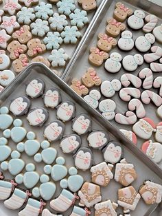 two trays filled with different types of decorated cookies