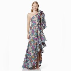 The Elliatt Elettra Gown Is A Multi-Colour Floral Dream! Vibrant And Show-Stopping In A One-Shoulder Cut And Burnout Jacquard Print, Enjoy A Flattering Silhouette And A Very Fun Print. For Your Next Wedding, Formal, Gala Or Black Tie Event. One Shoulder Silk Spring Gown, Silk One Shoulder Gown For Spring, Multicolor Maxi Gown For Gala, One Shoulder Floral Print Maxi Dress For Wedding, Pre-draped Gown For Spring Cocktail, One Shoulder Floral Print Gala Dress, Pre-draped Cocktail Gown For Spring, Pre-draped Spring Cocktail Gown, Multicolor Ruffled Dresses For Evening