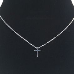 This tiny silver cross necklace is a classic addition to your layering necklaces. This minimalist necklace is also perfect by itself. The cross charm is sterling silver and measures approximately 12 mm in length or 1/2 inch. The chain is delicate looking but sturdy sterling silver. This dainty cross necklace is available in lengths from 15 - 18 inches. You may choose to add an attached extender. Your new necklace will come in a box, ready for gift giving. More Christian jewelry https://www.etsy. Silver Minimalist Cross Necklace With Clavicle Chain, Silver Cross Necklace With Clavicle Chain, Silver Cross Pendant Necklace For Everyday, Minimalist Sterling Silver Cross Necklace With Clavicle Chain, Minimalist Jewelry With Cross Pendant Clavicle Chain, Everyday Cross Pendant Charm Necklace, Minimalist Clavicle Chain Jewelry With Cross Pendant, Sterling Silver Clavicle Chain Cross Necklace, Sterling Silver Cross Necklace With Clavicle Chain