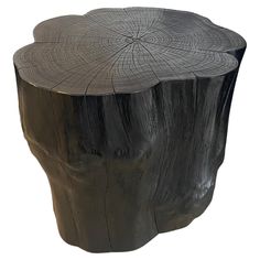 an image of a tree stump table that looks like it has been carved into the shape of a flower