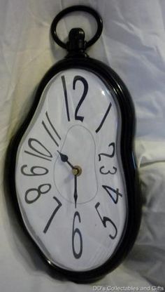 an image of a black and white clock with numbers on it's face that says alice in wonderland nursery