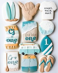 decorated cookies are arranged in the shape of surfboards and surfers'feet, with words on them