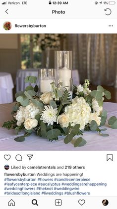 a table with flowers and candles on it