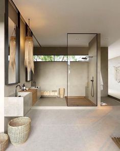 a bathroom with a large shower and two sinks