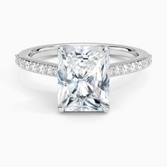 a princess cut diamond ring with pave set shoulders