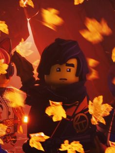 the lego movie character is surrounded by yellow leaves in front of an image of a man with