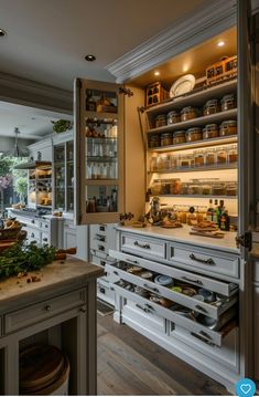 an open kitchen with lots of shelves and drawers