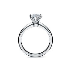 a white gold ring with a princess cut diamond