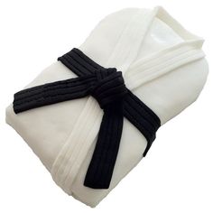 a white napkin with black ribbon tied around it