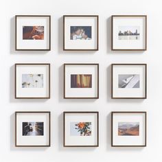 nine framed photographs hanging on the wall