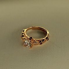 Gold Tone Ring

Measures Size 5.5. Features one round cut of clear cubic zirconia. The band is adjustable.

There are no markings, however, this was sold tested and labeled for its material.

The ring will ship out in a small black box as shown in the pictures. Black Box, Women's Jewelry, The Band, Round Cut, The Ring, Cubic Zirconia, Gold Tones, Women Jewelry, Band