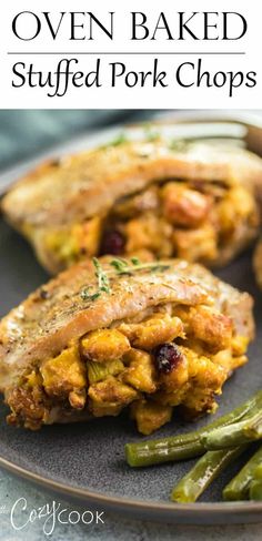 an oven baked stuffed pork chops on a plate with green beans