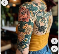 the back of a woman's shoulder with flowers and bees on it