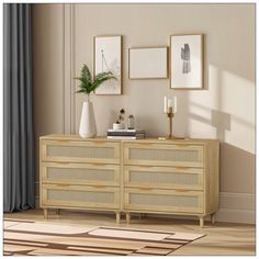 a living room scene with focus on the sideboard and pictures hanging on the wall