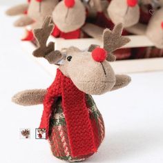 a stuffed reindeer with a red scarf around its neck