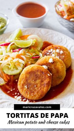 tortillas de papa mexican potato and cheese cakes on a white plate with sauce